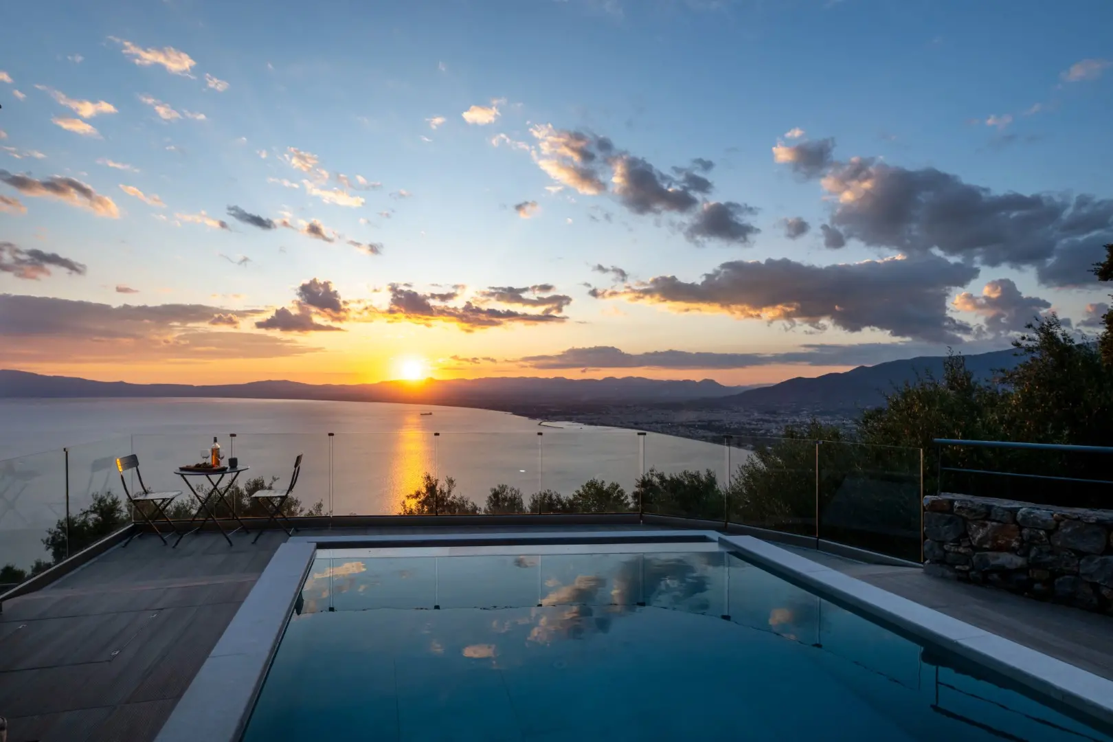 Sunset over the Messinian Bay from Kalma Luxury Villas